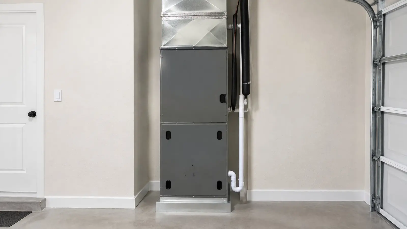 Upright air handler with a sheet-metal plenum in a garage utility closet